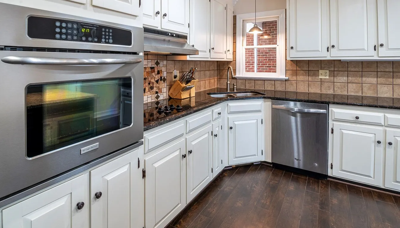 Kitchen with a stainless steel built-in microwave and wall oven