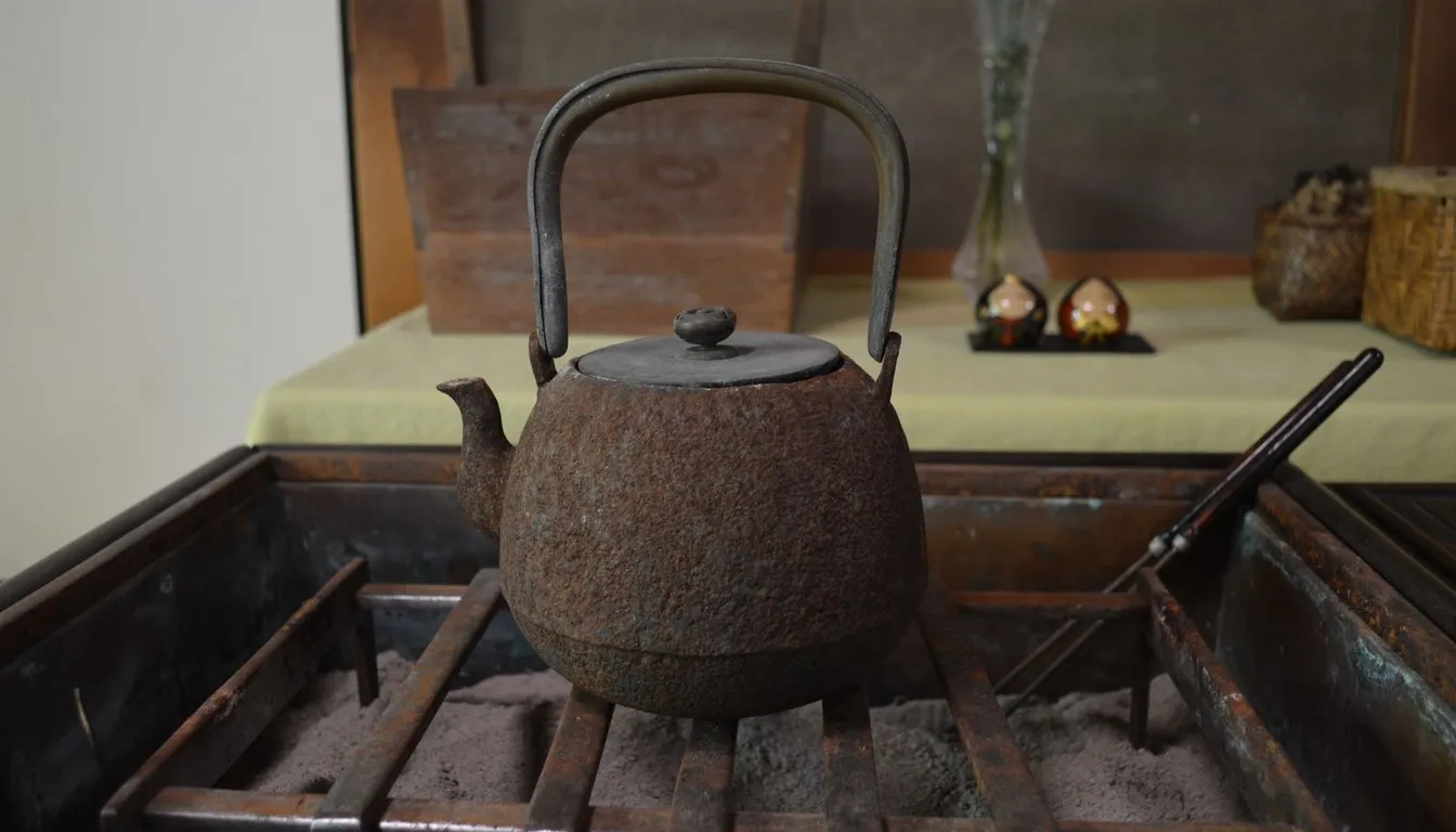 Rusted cast iron teapot on a hearth