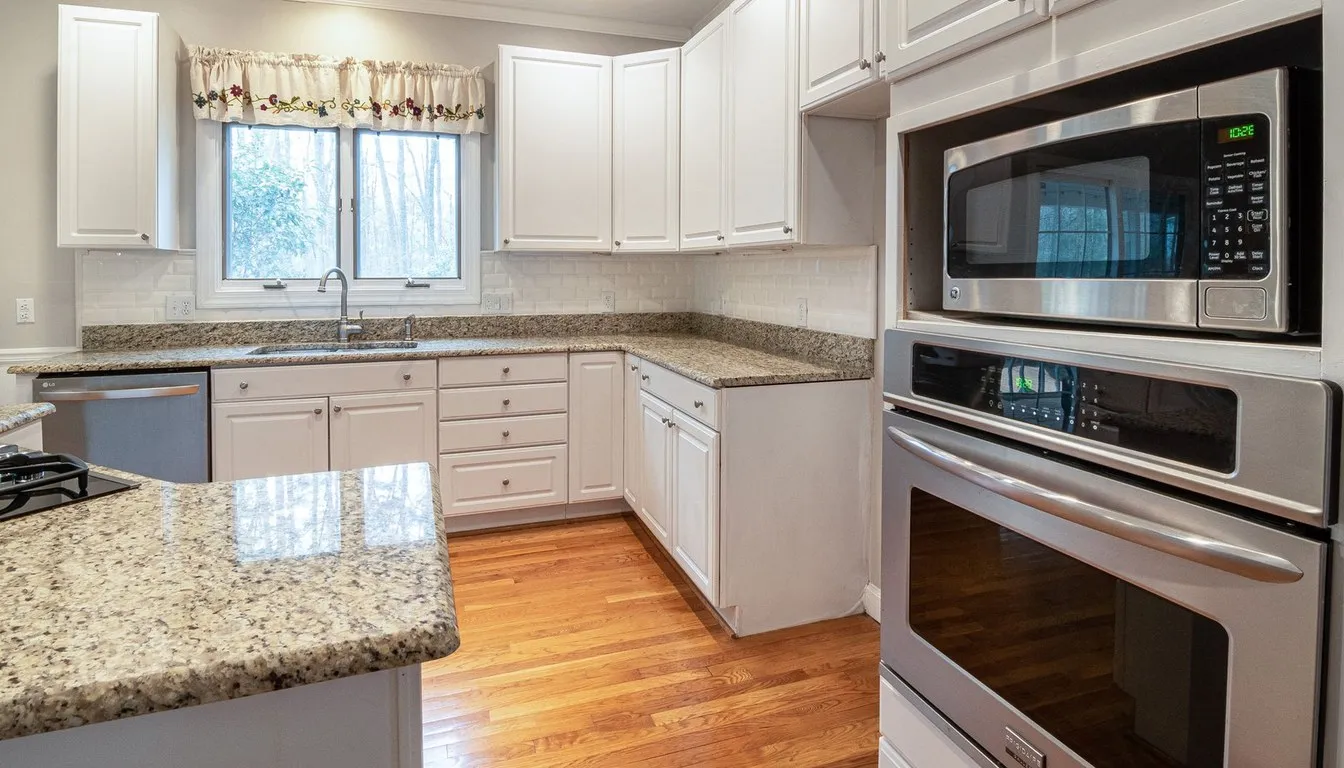 Kitchen with a stainless steel microwave and wall oven combination