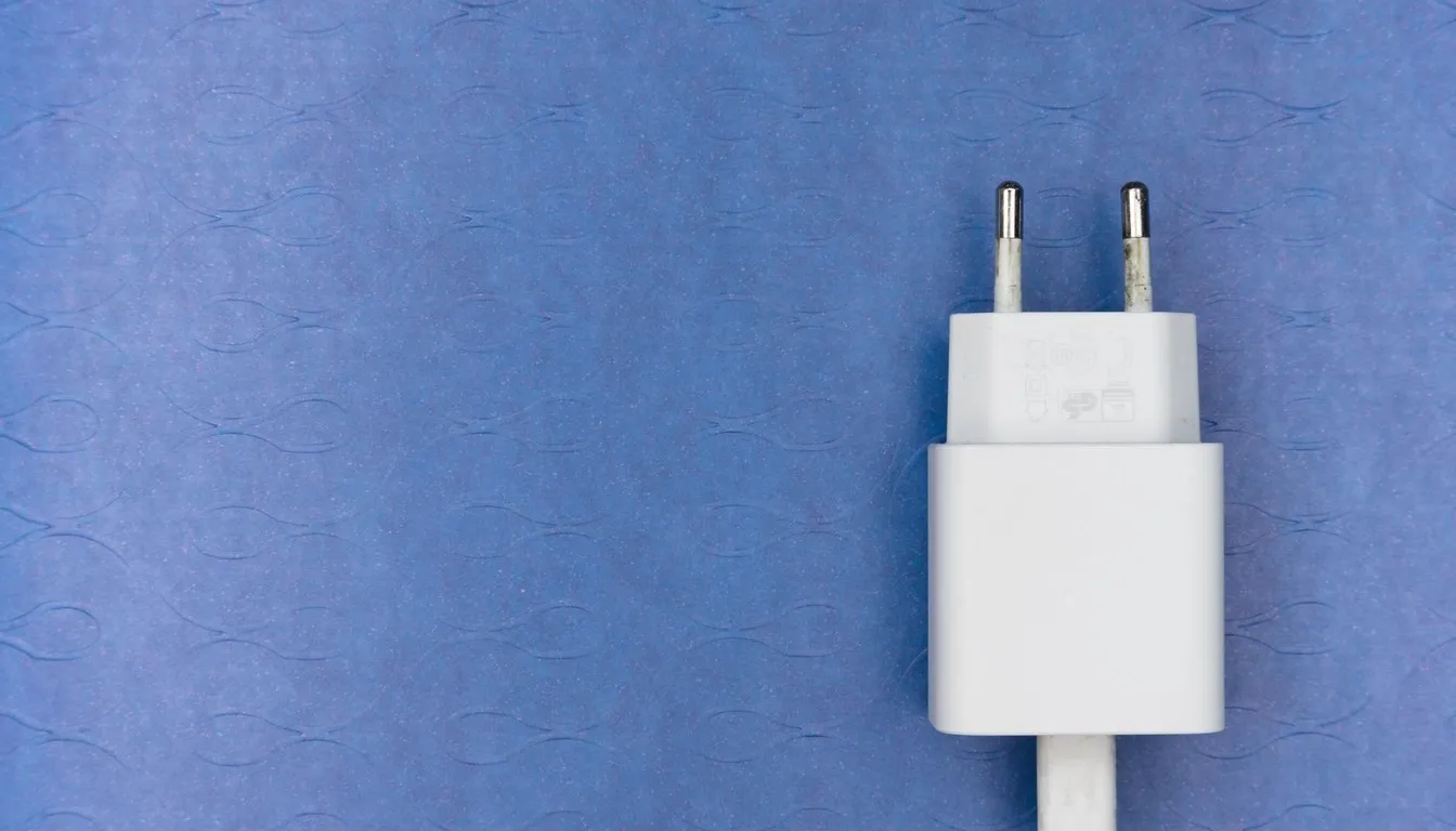 White plug-in device on a blue background