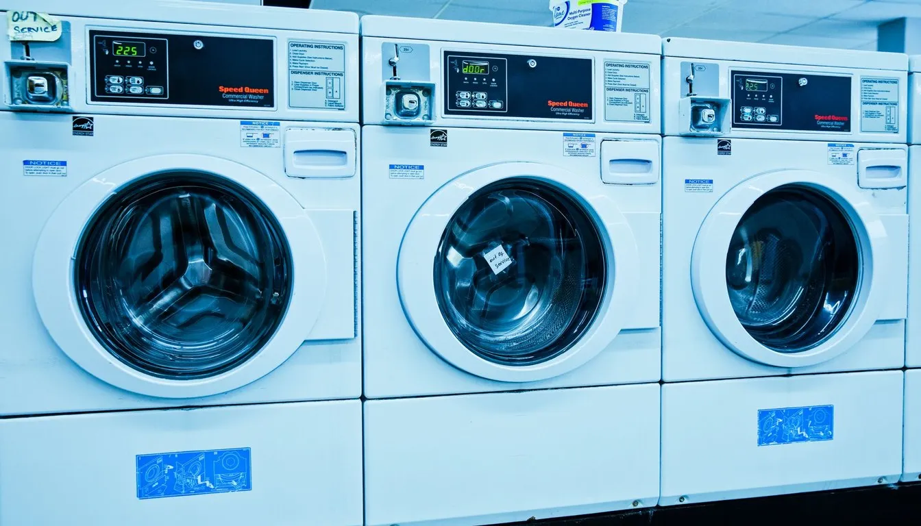 Bank of high-efficiency front-loading washers at a laundromat