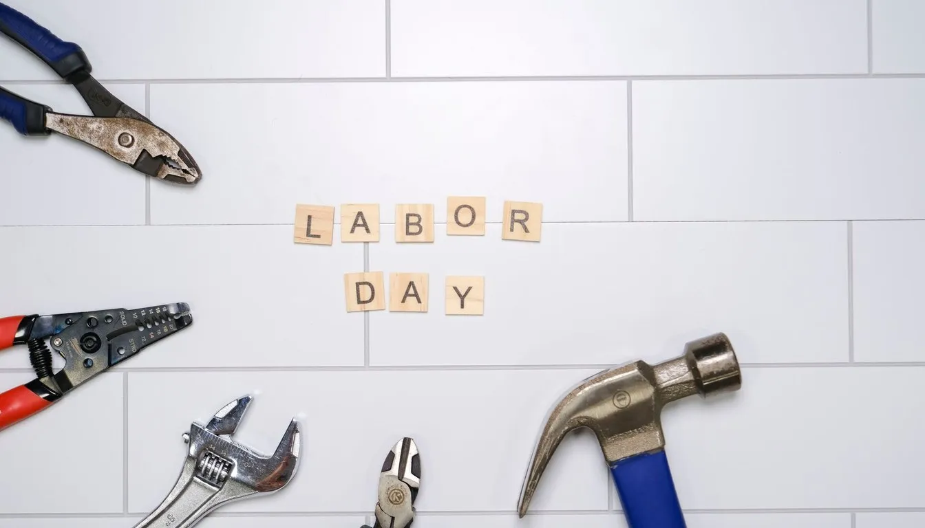 Hand tools laid out on white tile