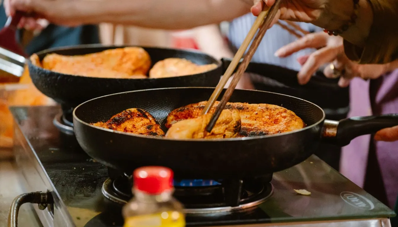 Food frying in a non-stick pan on a portable stove