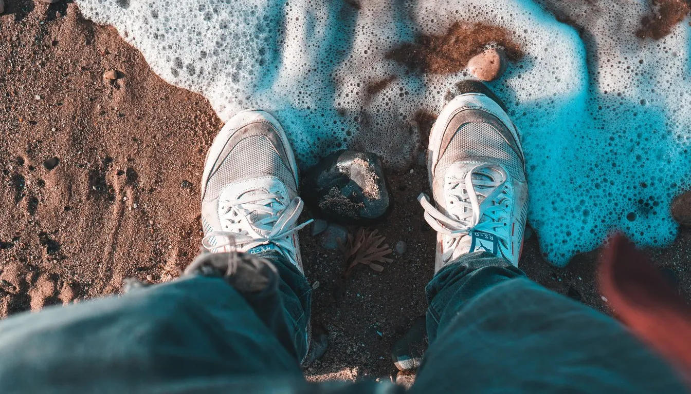 Sneakers standing in soapy foam