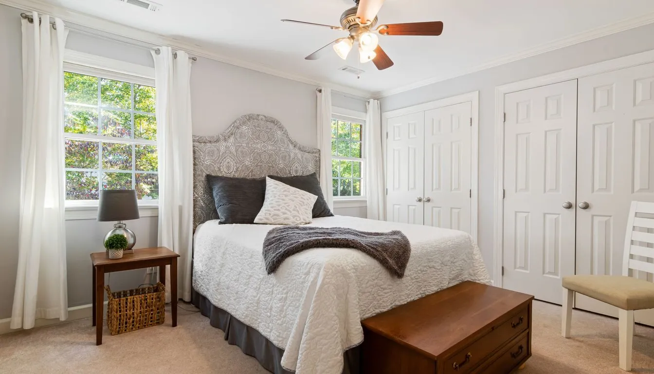 Bedroom with a ceiling fan above the bed