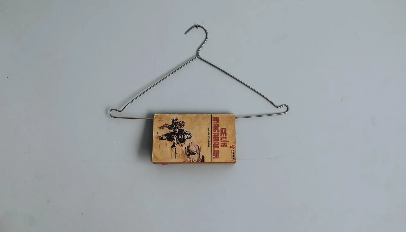 Wire coat hanger contraption on a wall