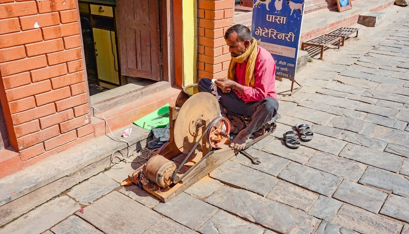 Street knife grinder sharpening a blade on a wheel