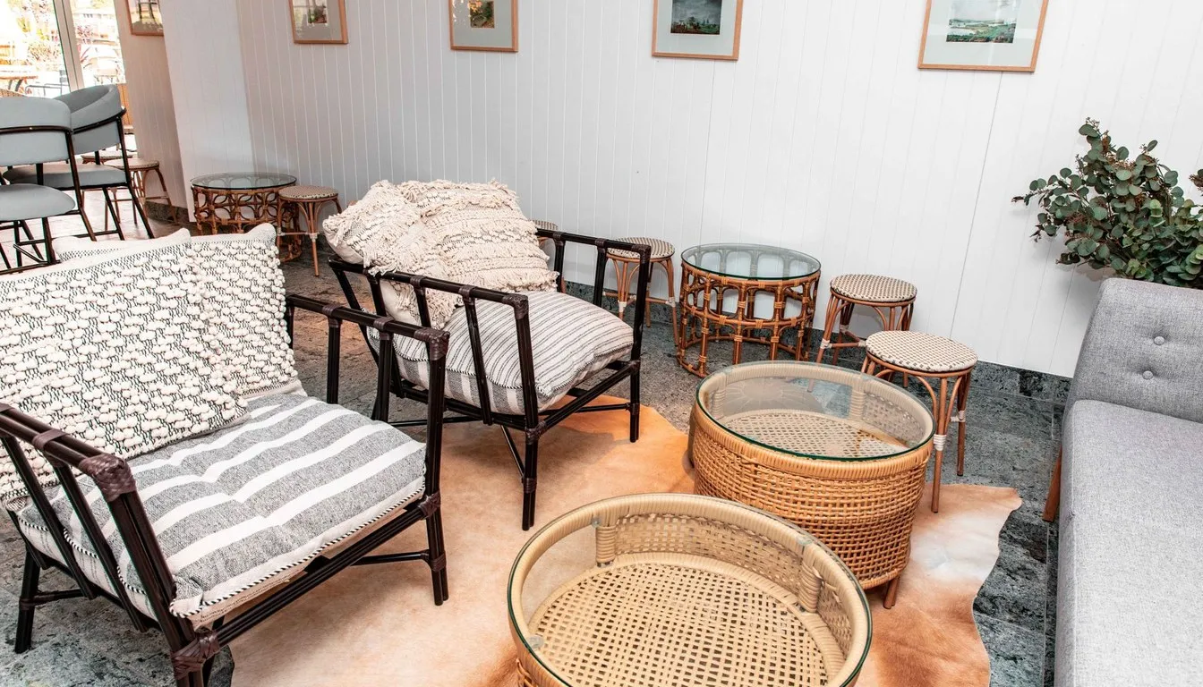 Woven seagrass and rattan chairs and tables in a lounge