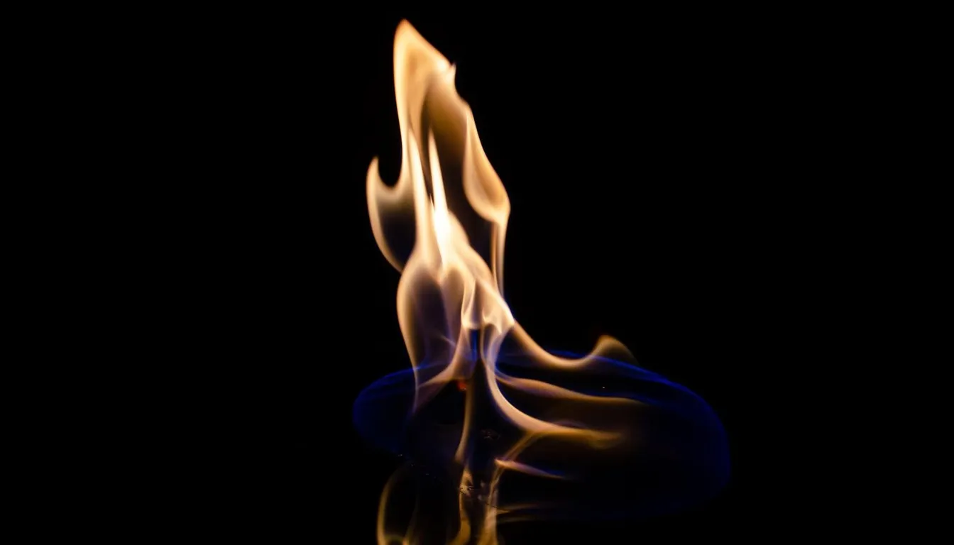 Blue-based flame burning against a dark background