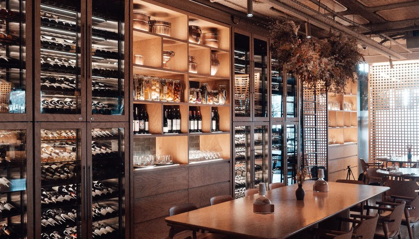 Wine bottles stored on cellar shelving