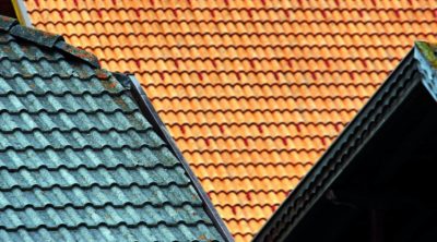colorful roof shingles laid by roofing companies