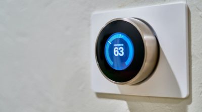home thermostat operated by an HVAC service